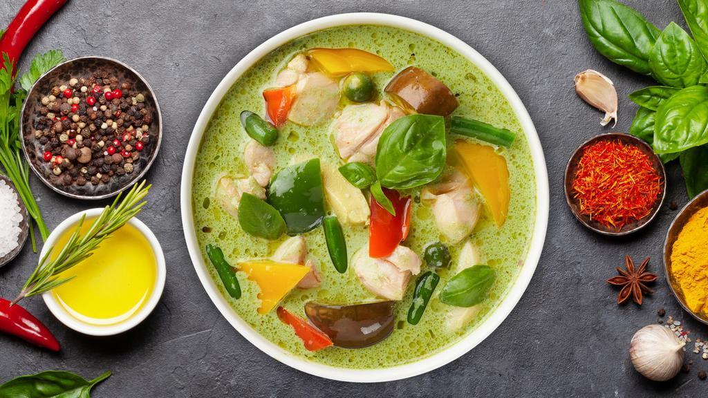 Green Curry · Broccoli, bamboo shoots, carrots, baby corn, mushrooms, zucchini, bell peppers, onions sauteed in a light creamy curry sauce, and fresh basil leaves.