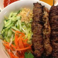 Bún Dac Biêt · Rice vermicelli salad with grilled pork, chicken and beef skewers.