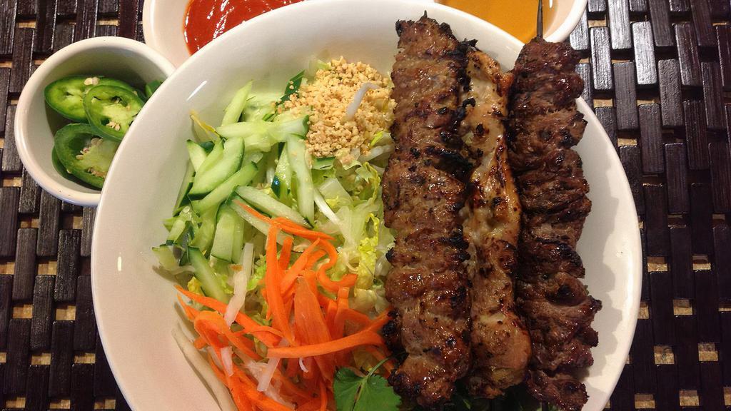 Bún Dac Biêt · Rice vermicelli salad with grilled pork, chicken and beef skewers.