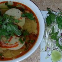 Bun Bo Hue · Spicy beef soup with thick vermicelli noodles, beef shank, slices of Vietnamese pork bologna...