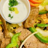 Combo Fajita Plate · Grilled gyro and chicken with grilled green peppers and onions.