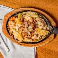 Pollo Tropical · Char-broiled chicken breast topped with shrimp peppers, pineapple and melted cheese and a sp...