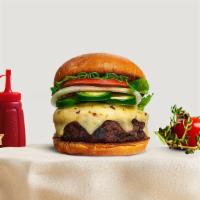 Jalapeno Translation Vegan Burger · Seasoned Beyond beef patty topped with melted vegan cheese, jalapenos, lettuce, tomato, onio...