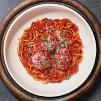 Spaghetti & Meatballs · Fresh spaghetti in our house made garlic marinara sauce paired with meatballs and topped wit...