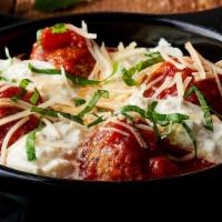 Braised Meatball Skillet · house-made meatballs and Tuscan tomato sauce, Burrata, Anson Mills organic stone ground grit...