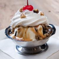 Hot Fudge Sundae · A miniature sundae with French vanilla ice cream topped with walnuts.