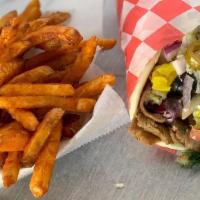Gyro Sandwich Combo · Beef and lamb gyro. Served on warm pita bread with lettuce, tomatoes, onions and sauce. Incl...