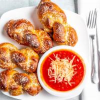 Garlic Knots 4 Or 8 Count · Made with our house pizza dough, brushed with garlic oil, sprinkled with Parmesan cheese wit...