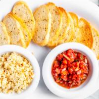 Mary’S Cheese & Tomato Bruschetta · Asiago cheese, Parmesan cheese, blended with spices and tomato bruschetta served with crosti...