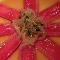 Tuna Tataki · Thinly Sliced Seared Tuna served with Onion & Ponzu Sauce.