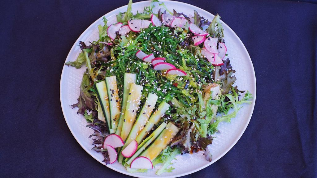 Seaweed Salad · Spring mix, citrus soy dressing, seaweed, sesame, radish, and cucumber.