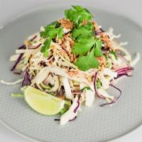 Vietnamese Chicken Salad · Cabbage, shredded chicken, red onions, cilantro, and fried shallots.