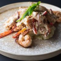 Peruvian Shrimp · Wok seared shrimp in a cream sauce topped with red bell peppers and served over wasabi mashe...