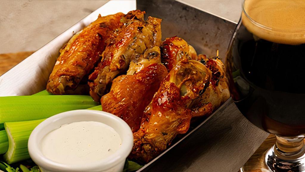 Garlic Rosemary Wings · our classic wings, marinated for 24 hours in rosemary and garlic and roasted to perfection in our wood-burning oven