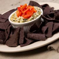 Spinach And Artichoke Dip · creamy dip with artichokes, spinach and diced tomatoes served warm with blue corn tortilla c...