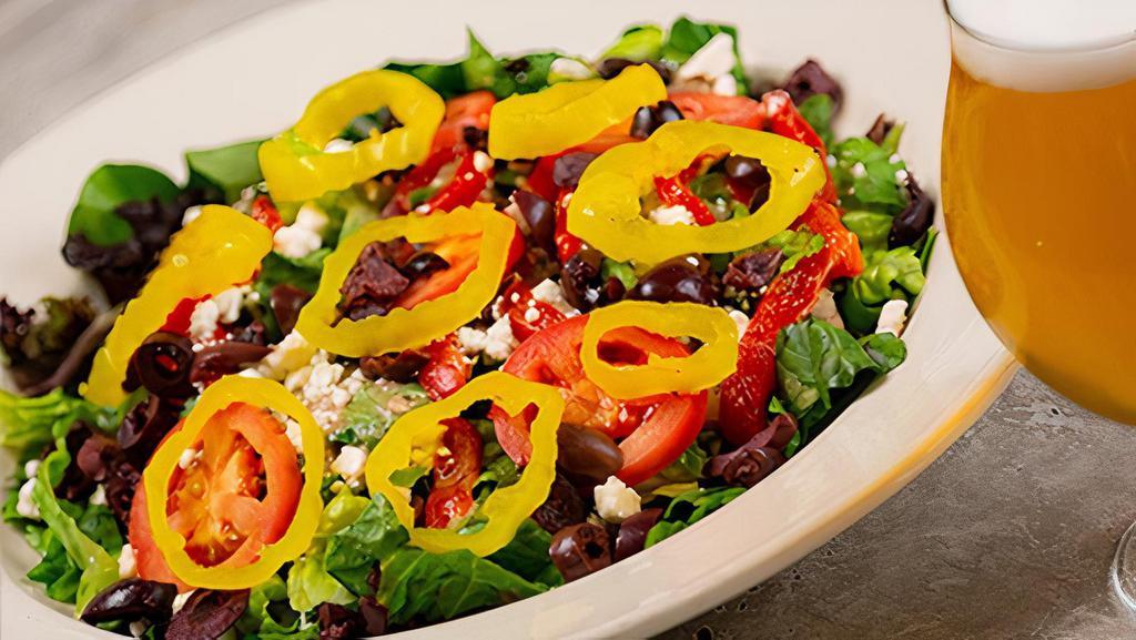 Mediterranean Salad · chopped romaine hearts drizzled with housemade feta vinaigrette, roma tomatoes, kalamata olives, roasted red peppers, feta cheese & banana peppers