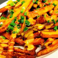 Topped Sweet Potato Fries · Vegetarian. With spicy honey mayo and fresh green onions.