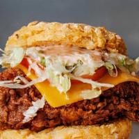 Chicken Classic · Fried chicken topped with shredded lettuce, pickled tomato, cheddar cheese, and Comeback Sau...