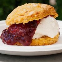Dolly Madison · Biscuit with house made cream cheese frosting and mixed berry jam.