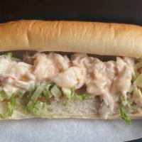 Lobster Roll · Chopped Lobster with  Lettuces and Tomato on Hoagie Roll with Homemade White Sauce. Serve wi...