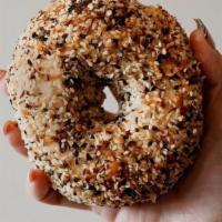 Everything Bagel · Handmade everything bagel. Topped with white & black sesame seeds, poppy seeds, caraway seed...