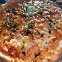 Hawaiian Volcano Pizza · Pineapple, ham, basil, tomato sauce, mozzarella, and jamaican volcano hot sauce