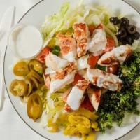 Chicken Salad · Grilled chicken breast marinade with our spices served with Greek salad.