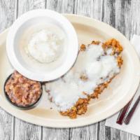 Chicken Fried Steak · Hand-breaded and fried golden brown, served with mashed potatoes and gravy and black-eyed pe...
