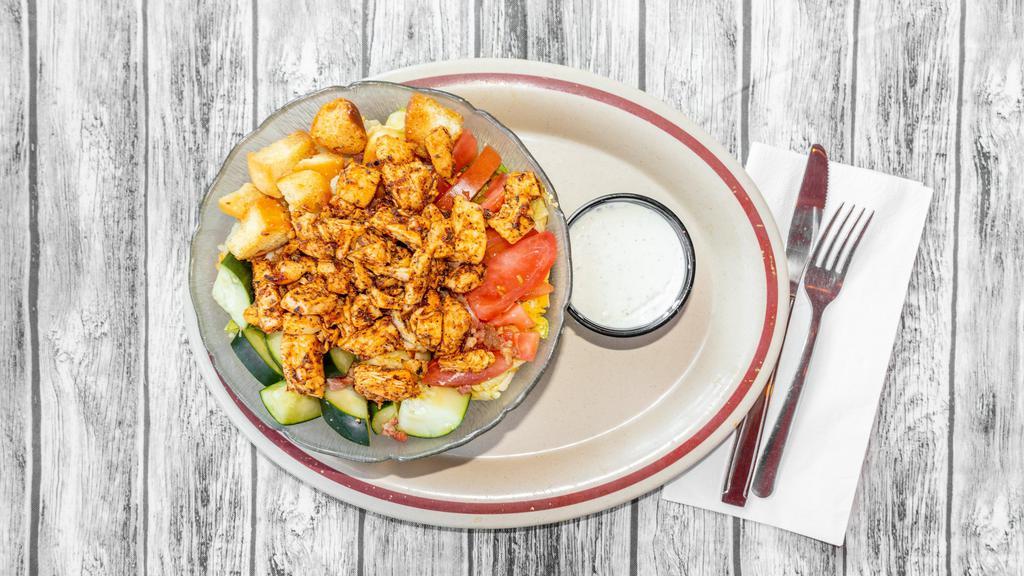 Blackened Chicken Salad · Our house salad topped with blackened grilled chicken breast.