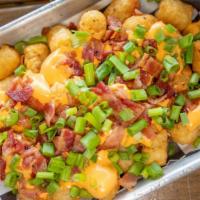 Loaded Tots · Smothered in O'Connor proper lager beer cheese, house bacon crumbles and topped with green o...