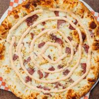 Irish Rueben Pizza · 4 Cheese, pizza sauce, saurekraut, corned beef, swiss cheese, Thousand Island swirl