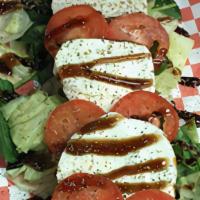 Caprese Salad · Iceburg and Spinach Mix, Tomato, Fresh Mozzeralla, Roasted Red Peppers, Italian Seasonings, ...