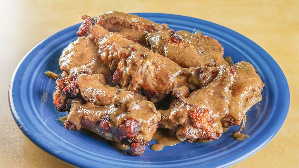 Island Wings · Choice of Island, BBQ Mild or Spicy Jerk.