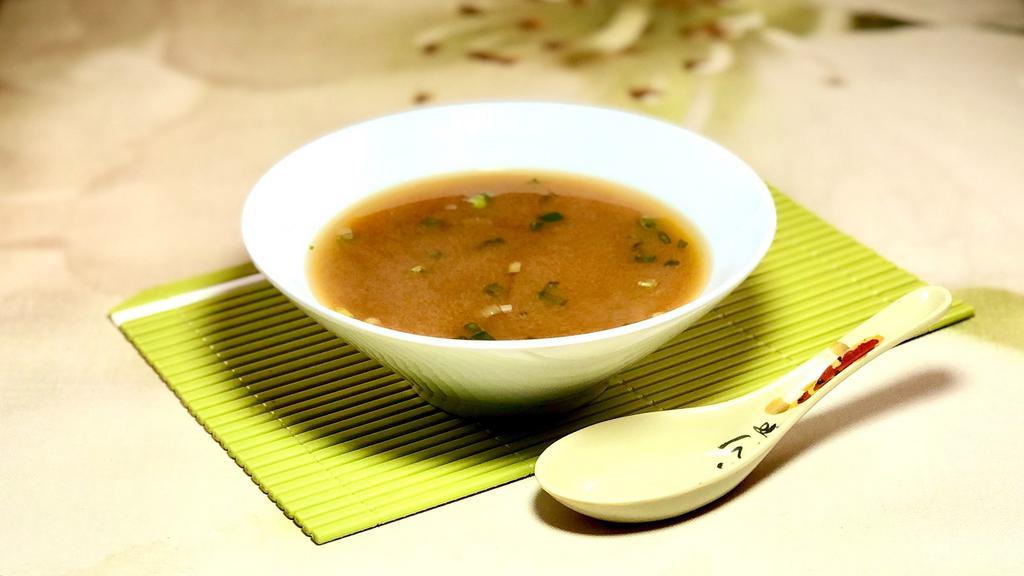 Miso Soup · Traditional soybean paste soup.