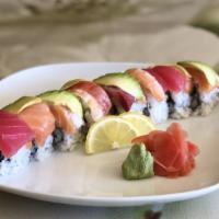 Rainbow Roll · Crab and cucumber wrapped with slices of salmon, tuna, shrimp, yellow tail and avocado.