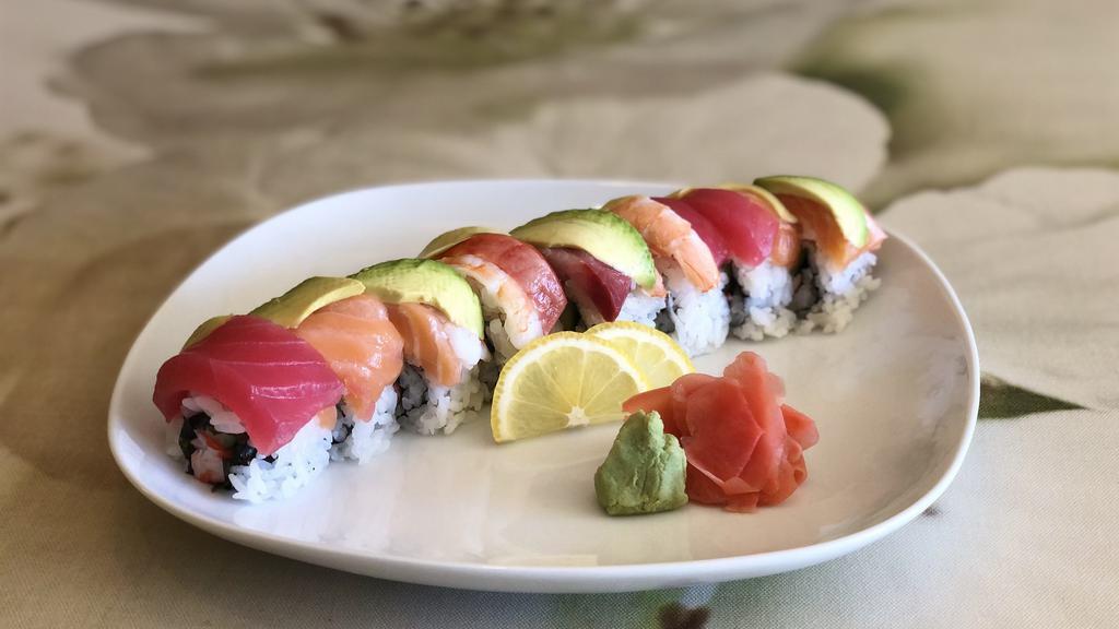 Rainbow Roll · Crab and cucumber wrapped with slices of salmon, tuna, shrimp, yellow tail and avocado.