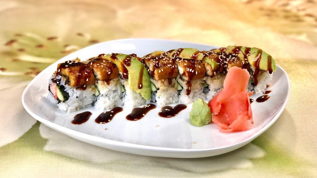 Dragon Roll · Crab, cucumber and shiso wrapped with fresh water eel and avocado and topped with sweet eel sauce and sesame seeds.