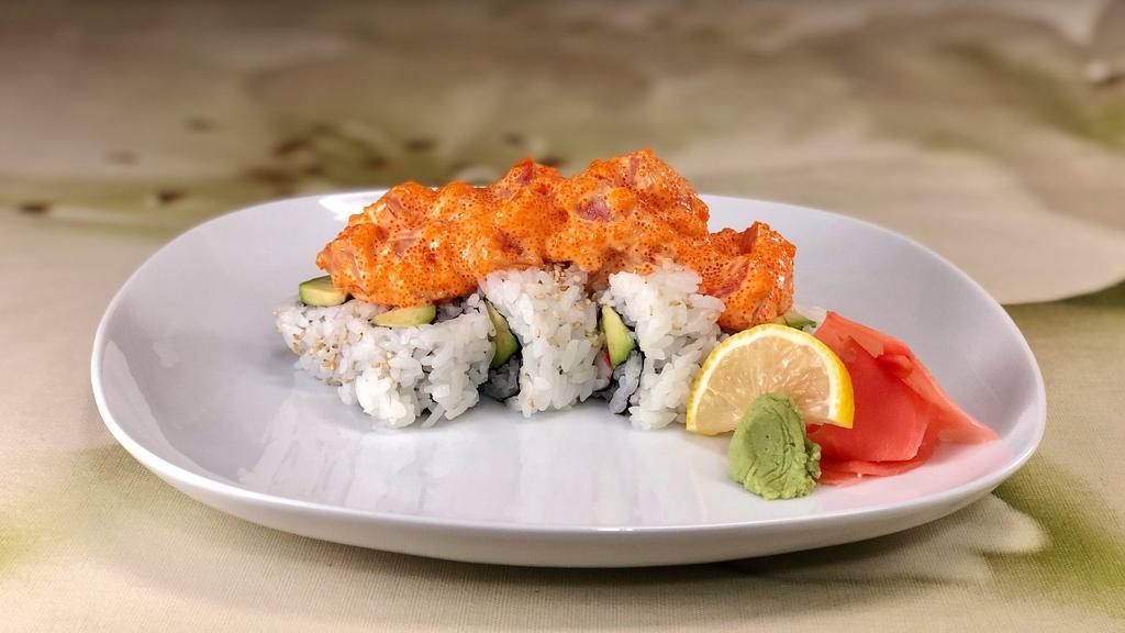 Dynamite Roll · California roll smothered with cubed tuna, smelt roe, spicy sesame oil and spicy sauce.