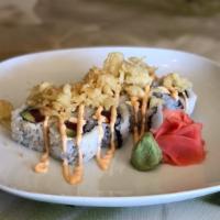 Typhoon Roll · Spicy tuna, cream cheese and avocado topped with tempura crunchy bits.