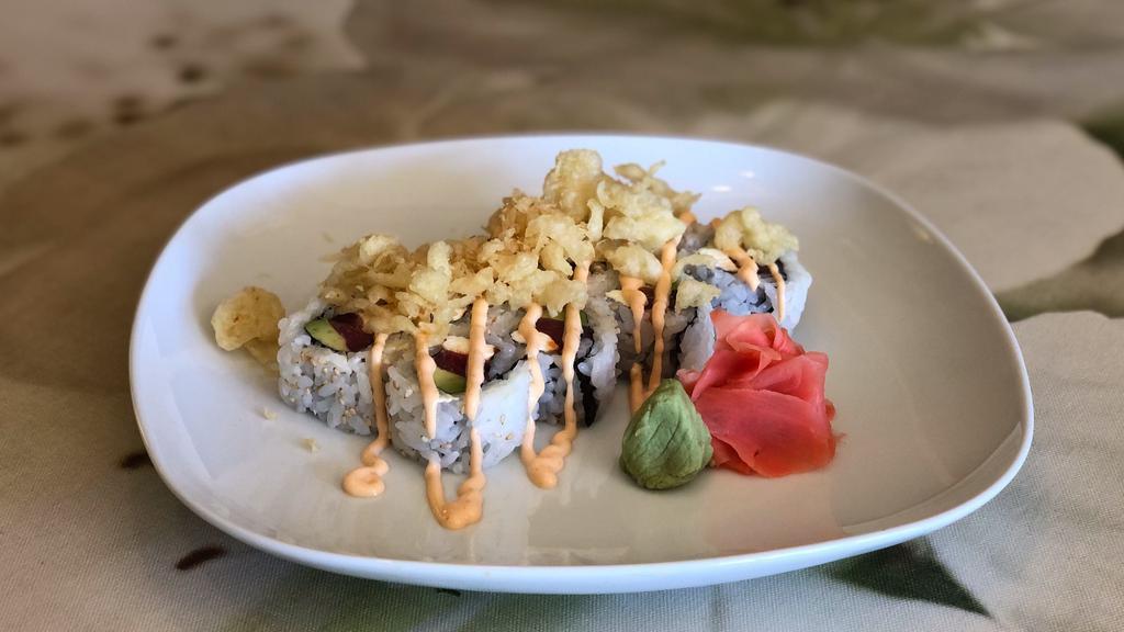 Typhoon Roll · Spicy tuna, cream cheese and avocado topped with tempura crunchy bits.