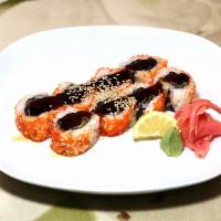 Yummy Yummy Roll · Marinated tuna and spices wrapped in seaweed and fried then wrapped with smelt roe and toppe...