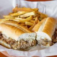 Philly Cheesesteak Sandwich · Thinly sliced seasoned steak grilled and topped with grilled onions and melted cheese, serve...