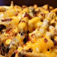 Bacon Cheese Fries · Fresh hand-cut fries smothered in grated cheddar and monterey jack cheese and bacon. Served ...