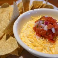 Buffalo Chicken Dip · Unbelievable Buffalo Chicken Dip topped with grated mixed cheeses and fresh  pico de gallo. ...
