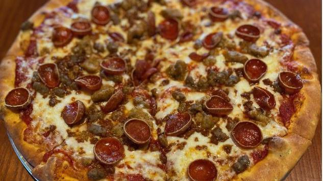 Carnivore · If you enjoy A LOT of flavors, try some Pepperoni, Italian Sausage, Ground Beef, & Chorizo piled high on homemade sauce and a sharp provolone cheese blend!