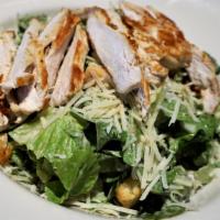 Chicken Caesar Salad · Lightly marinated grilled chicken breast served over crisp romaine lettuce tossed with caesa...