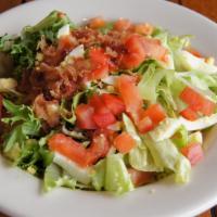 Garden Fresh Salad · Fresh mixed greens topped with diced tomatoes, eggs and bacon. Served with your dressing of ...