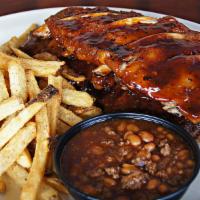 Bbq Baby Back Ribs · Tie on a napkin for this plate of premium tender, fall-off-the-bone barbecued ribs. Glazed w...