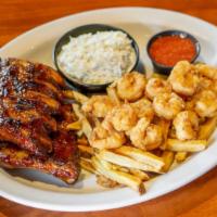 Ribs & Shrimp Combo · A full rack of baby back pork ribs plated with six jumbo hand-breaded shrimp. Served with yo...