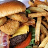 All American Burger · Topped with lettuce, tomato, bacon, american cheese, fried pickles and mayonnaise.